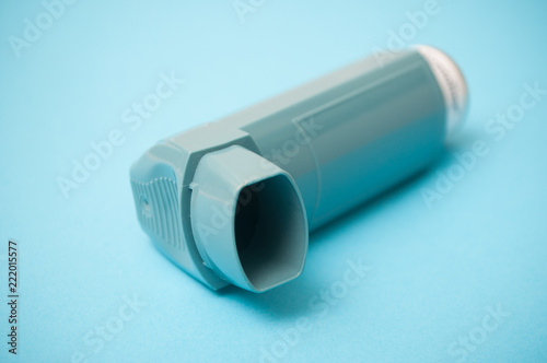 closeup of asthma aerosol on blue background