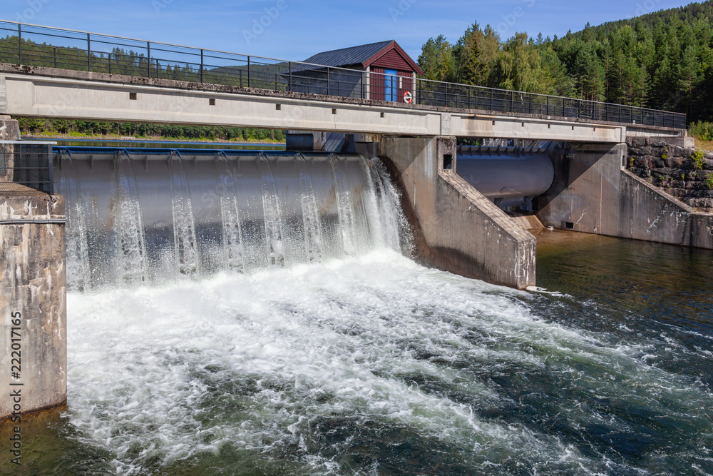Old dam on the picturesque Telemark canal. Touristic attraction surrounded by pine forest in Southern Norway