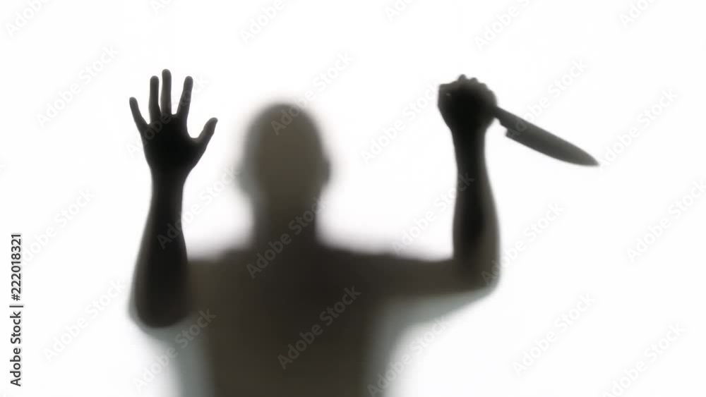 Silhouette of a knife wielding killer. Great for Halloween. Silhouette of a knife wielding killer. Great for Halloween.
