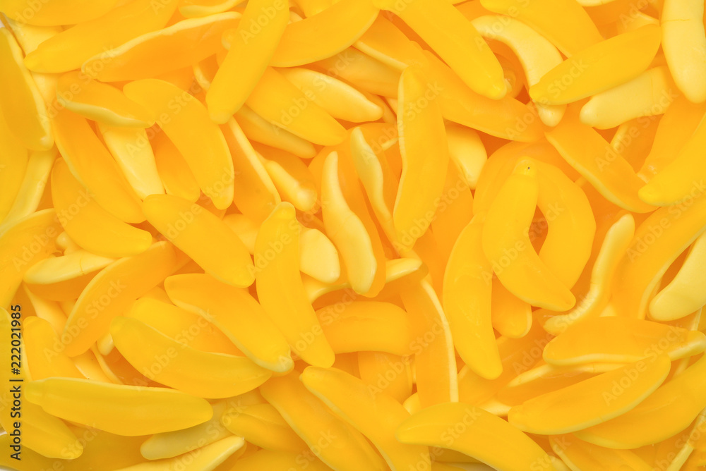 Yellow banana gummy candies. Top view. Jelly sweets. Yellow banana gummy candies. Top view. Jelly sweets.