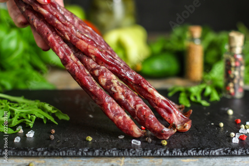 meat smoked jerky - raw meat sausage meat. food background. top view and copy space