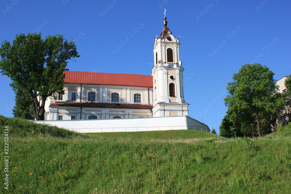 Sights and views of Grodno. Belarus. Franciscan church on a high hill on a summer day.
