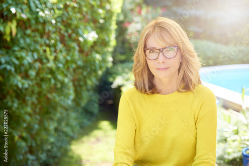 Portrait of beautiful middle age woman relaxing outdoor