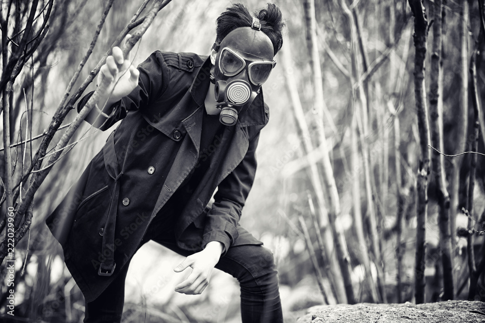 Foto Stock The guy in the coat and gas mask. Post-apocalyptic portrait of A  | Adobe Stock