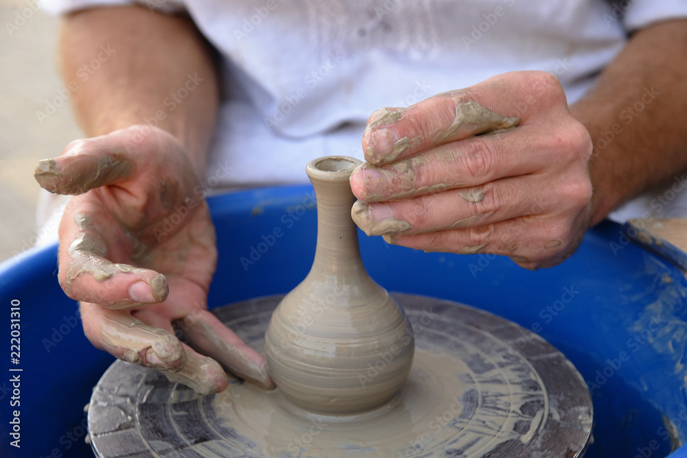hands of the master of pottery at work