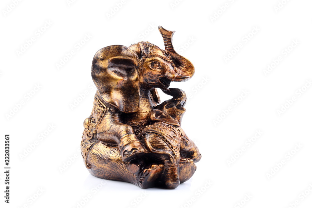Gold Black Brown Engraved pattern gold elephant made of resin like wooden carving with white ivory. Stand on white background, Isolated, Art Model Thai Crafts, For decoration Like in the spa. Gold Black Brown Engraved pattern gold elephant made of resin like wooden carving with white ivory. Stand on white background, Isolated, Art Model Thai Crafts, For decoration Like in the spa.
