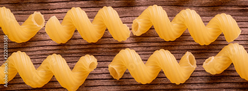 Pasta raw on wooden background
