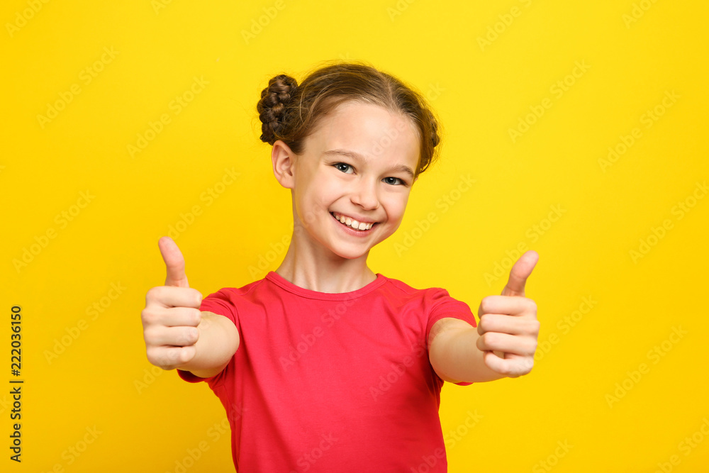 Cute young girl on yellow background Cute young girl on yellow background