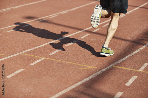 male athlete running on track