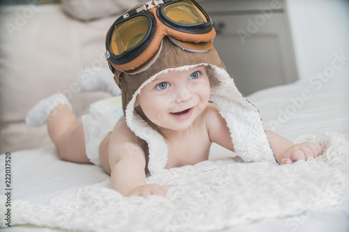the baby is dressed as a pilot