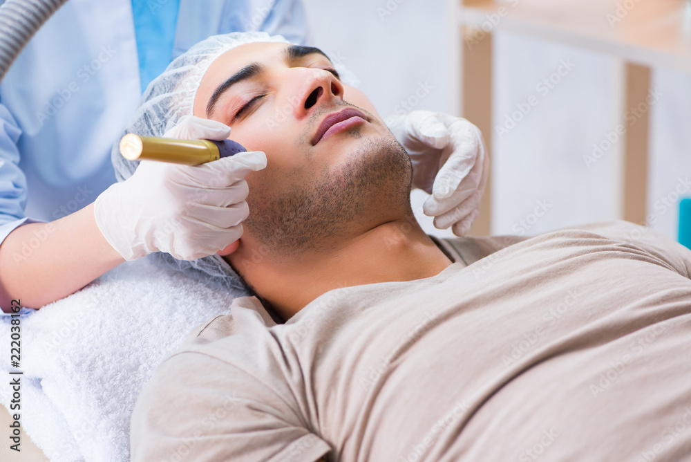 Man visiting dermatologyst for laser scar removal Man visiting dermatologyst for laser scar removal