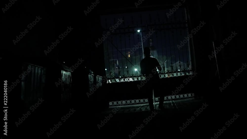 Silhouette of dancing man with night city lights slow-mo Silhouette of dancing man with night city lights slow-mo