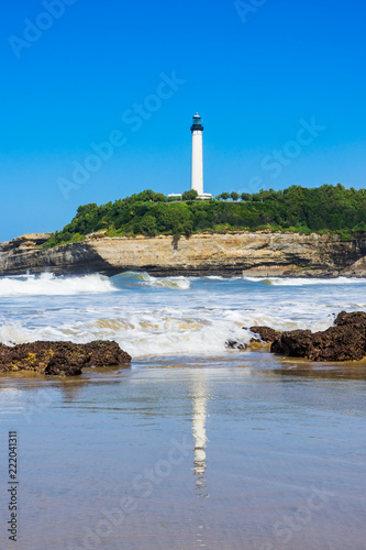 The lighthouse of Biarritz with reflection on the sea. Basque country of France.