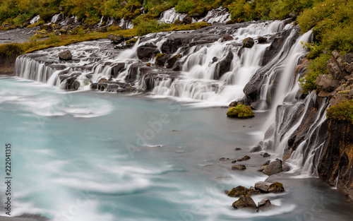 Hraunfossar Barnafoss waterfall Iceland, a series of waterfalls formed by rivulets streaming over a distance of about 900 metres out of the Hallmundarhraun lava field photo