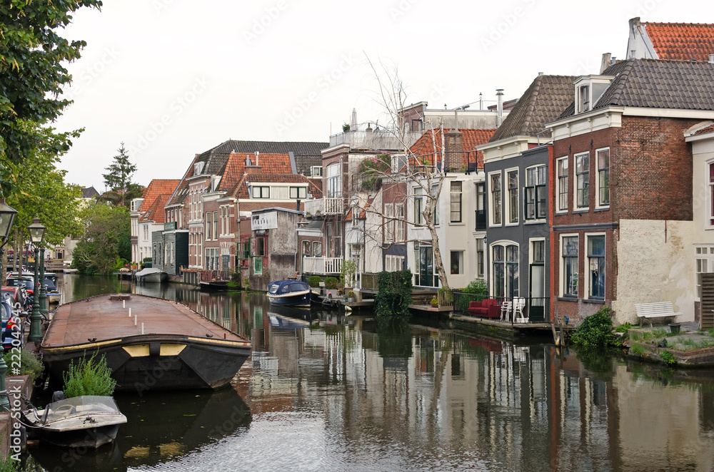 Old typical dutch houses overlooking a canal. Leiden, The Netherlands. World water day.