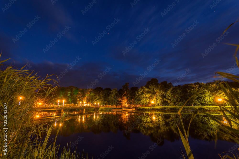Night shot over the lake with bridge and stars