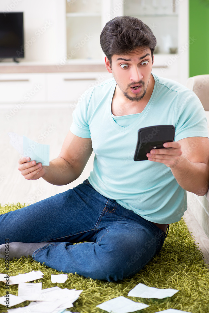 Young man struggling with personal finance and bills Young man struggling with personal finance and bills