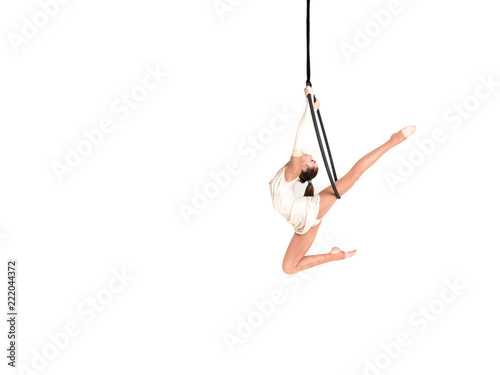 Young girl posing in an airy ring on a white background