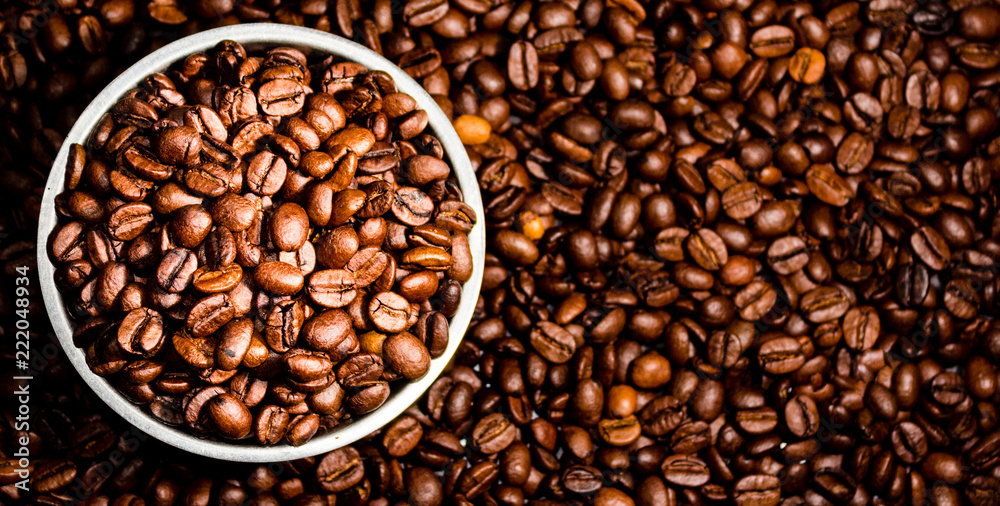 Top view of coffee beans in a bowl Top view of coffee beans in a bowl