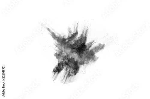 particles of charcoal on white background,abstract powder splatted on white background,Freeze motion of black powder exploding or throwing black powder. © kitsana