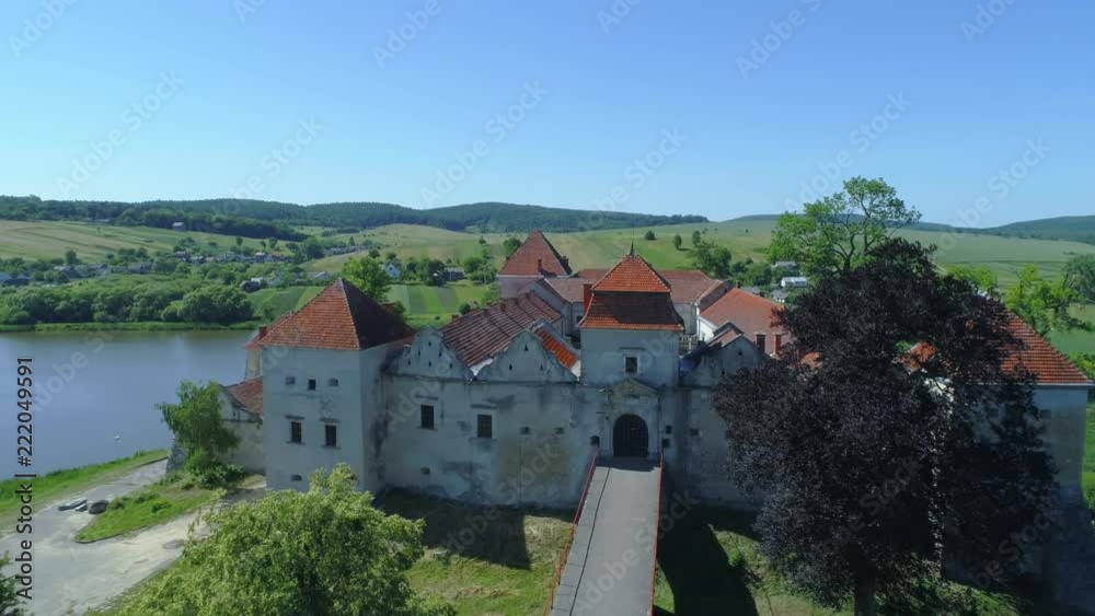 Aerial view of Medieval Renaissance castle located on the hills in Europe Aerial view of Medieval Renaissance castle located on the hills in Europe