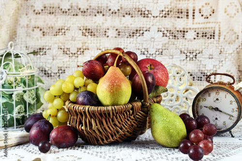 autumn fruits in vicker basket photo