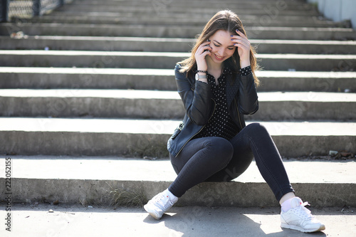 Girl on a walk through the spring city