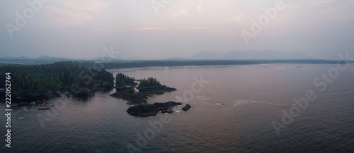 Aerial panoramic seascape view of Pacific Ocean Coast during a cloudy summer sunrise. Taken near Tofino and Ucluelet, Vancouver Island, BC, Canada.