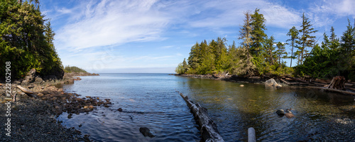 Beautiful panoramic view of a rocky beach during a vibrant sunny summer day. Taken in Port Hardy, Northern Vancouver Island, BC, Canada. © edb3_16