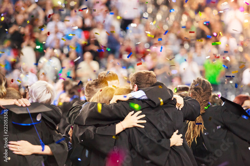 Students celebrating graduation day, authentic photo