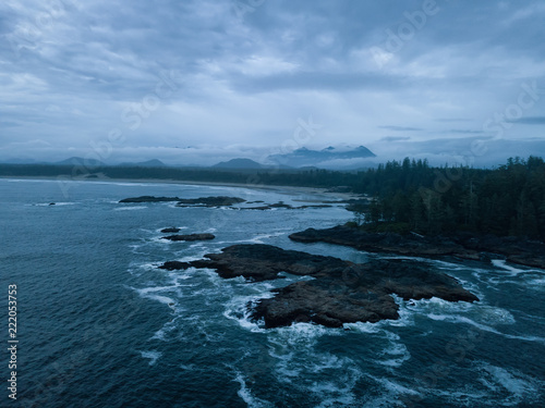 Aerial seascape view of the Pacific Ocean Coast during a cloudy summer sunset. Taken near Tofino and Ucluelet, Vancouver Island, BC, Canada.