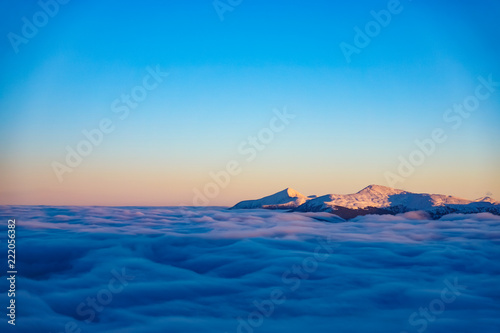 Amazing evening winter mountain landscape background with higest Ukrainian peaks Hoverla and Petros photo