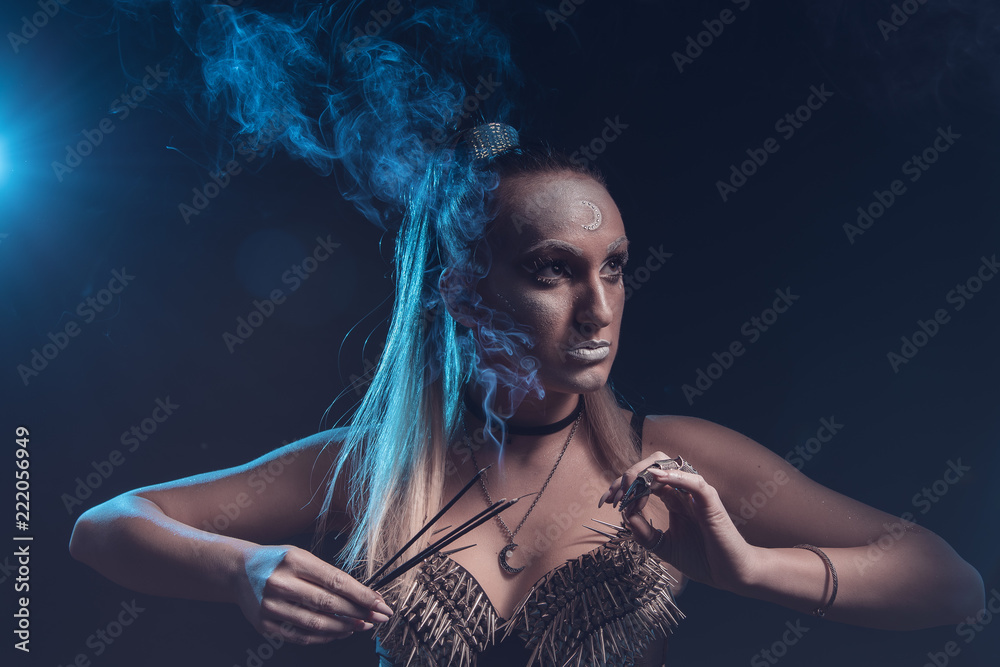 Strong tribal woman warrior, moon goddess or a priestess