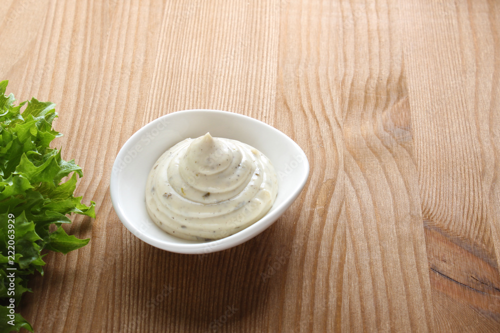 mayonnaise sauce, sour cream on a wooden background mayonnaise sauce, sour cream on a wooden background