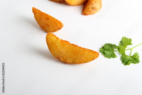country slices potatoes on white background