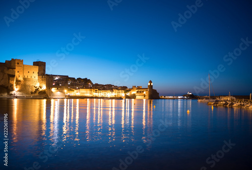 Beautiful small bay with old church of Our Lady of the Angels in the Collioure at late evening.
