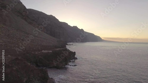 Los Gigantes at Tenerife, Canary Island just before Sunrise. 4K aerial Footage. photo