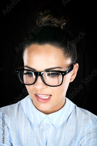 Beauty portrait of a woman glasses and looking at camera