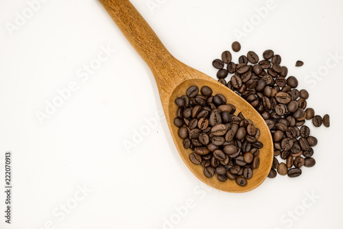 Coffee beans in wooden spoon