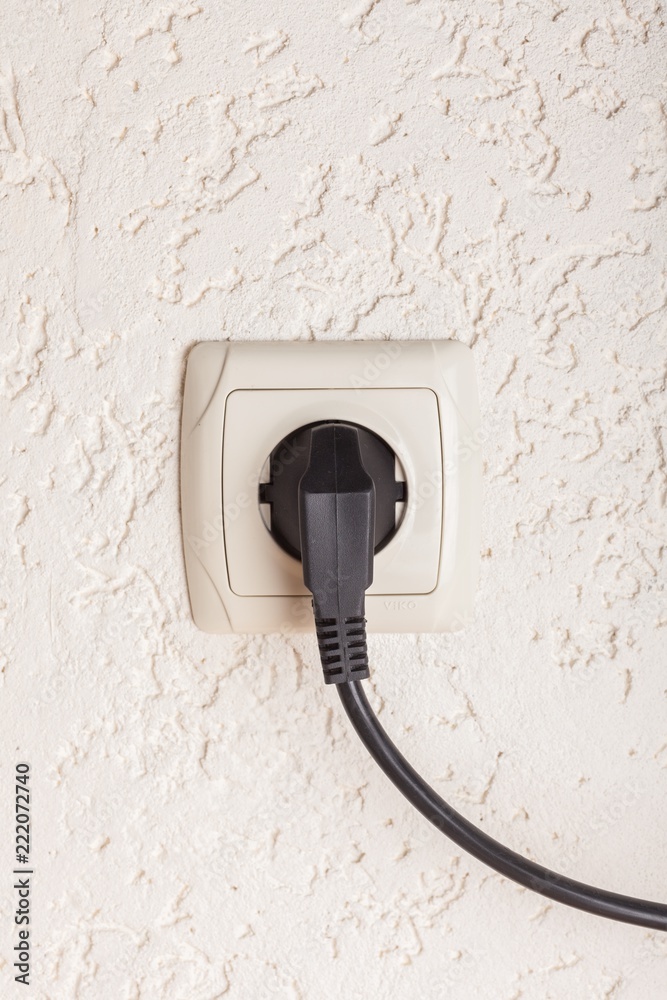 Electric Plug and Socket on Wall Electric Plug and Socket on Wall