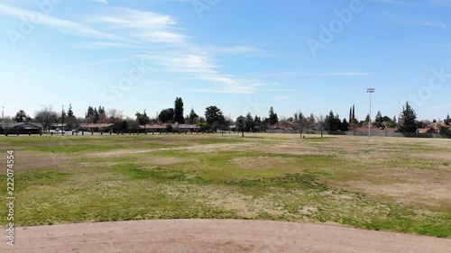 Beautiful aerial drone shot of a suburban Park in Clovis California with a United States Flag. photo