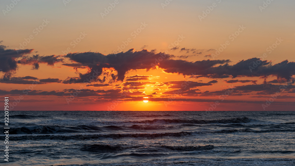 Bright colorful sunrise on the seashore