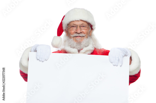 Christmas. Good Santa Claus in white gloves holds a blank white cardboard. Place for advertising, for text, empty space. Copy-paste. Isolated on white background.