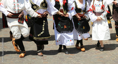many children dancing with european clothes