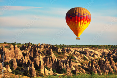 Hot air balloon in the air, popular tourist attraction in Cappadocia, Turkey