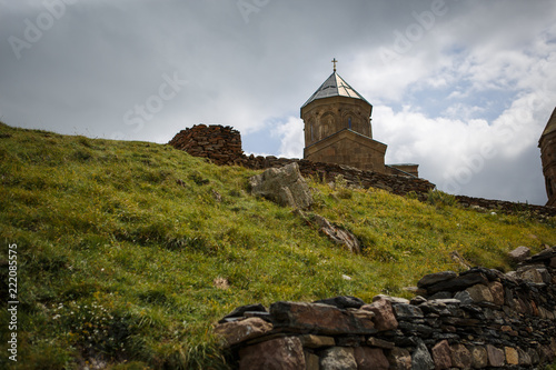 Yellow stone Church on top of the mountain in Stepantsminda, in Georgia