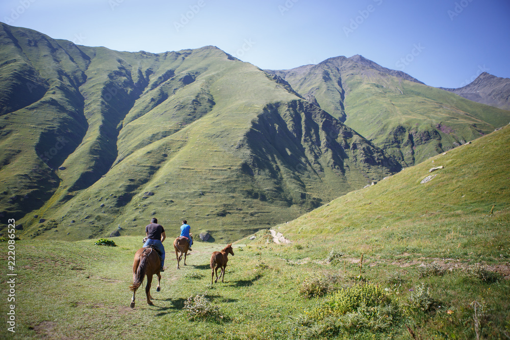 Horses and people on mountain roads of Georgia