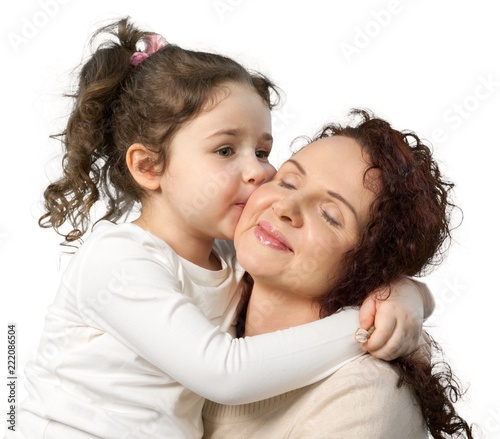 Portrait of Young Girl Kissing Mother