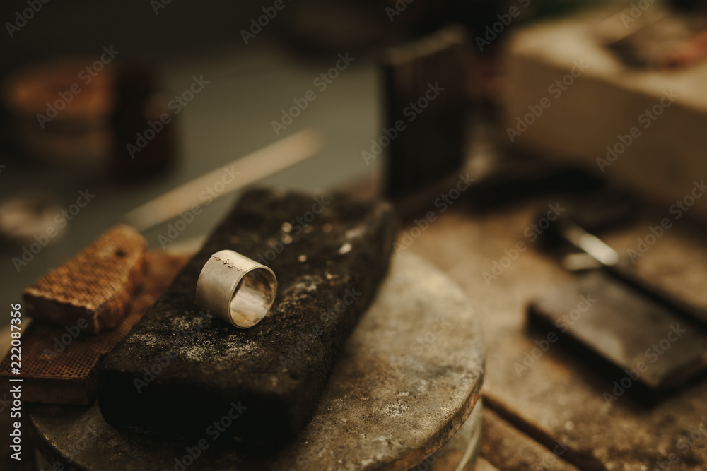 Ring on jeweler working table Ring on jeweler working table