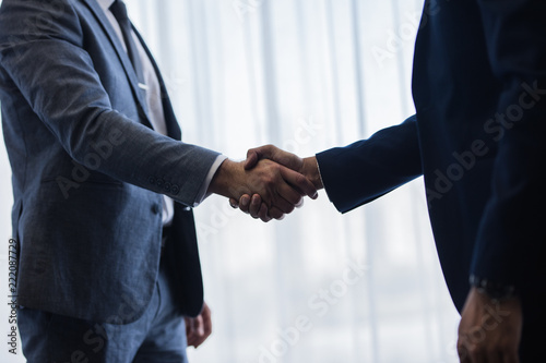 Businessmen handshaking after good deal